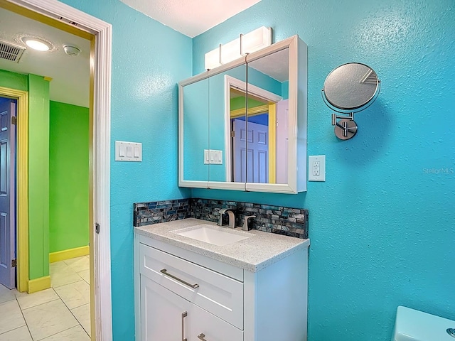 6428 Old Main St, New Port Richey, FL 34653 - half bath with vanity, decorative backsplash, and a textured wall