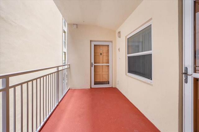 13000 Gulf Blvd Unit 309, Madeira Beach, FL 33708 - view of exterior entry with a balcony and stucco siding