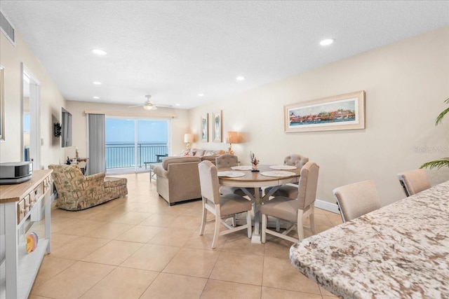 13000 Gulf Blvd Unit 309, Madeira Beach, FL 33708 - dining room with ceiling fan, recessed lighting, light tile patterned floors, and a textured ceiling