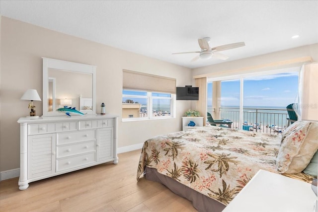 13000 Gulf Blvd Unit 309, Madeira Beach, FL 33708 - bedroom with wood finished floors, access to exterior, a ceiling fan, and recessed lighting