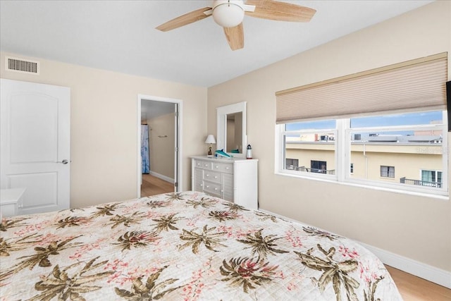 13000 Gulf Blvd Unit 309, Madeira Beach, FL 33708 - bedroom featuring wood finished floors and ceiling fan