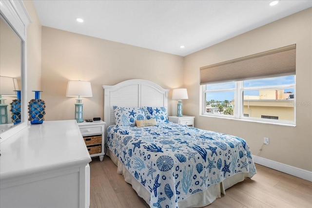 13000 Gulf Blvd Unit 309, Madeira Beach, FL 33708 - bedroom featuring light wood-style floors and recessed lighting