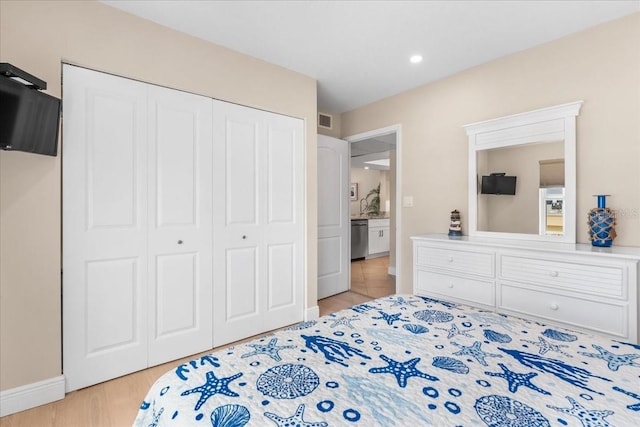 13000 Gulf Blvd Unit 309, Madeira Beach, FL 33708 - bedroom with a closet, light wood finished floors, and recessed lighting