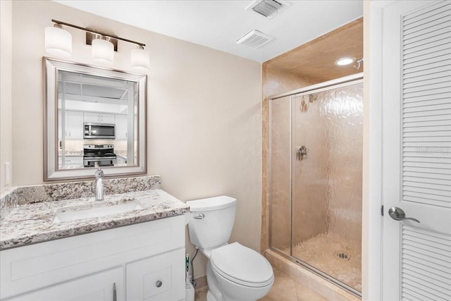 13000 Gulf Blvd Unit 309, Madeira Beach, FL 33708 - bathroom with vanity, a stall shower, a closet, and tile patterned flooring