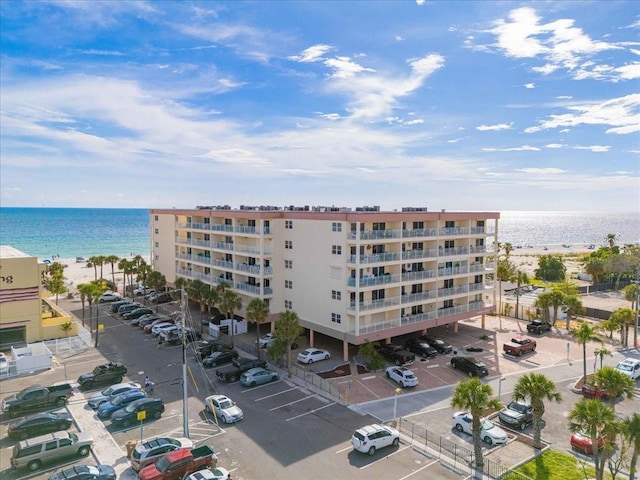 13000 Gulf Blvd Unit 309, Madeira Beach, FL 33708 - view of apartment building / complex featuring a water view and uncovered parking