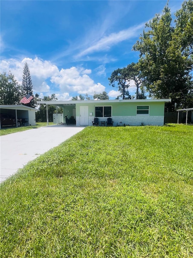 6316 Alaska Ave, New Port Richey, FL 34653 - ranch-style home with a carport, driveway, and a front yard