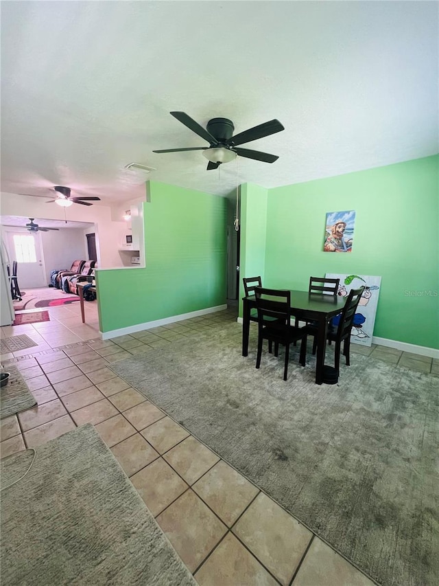 6316 Alaska Ave, New Port Richey, FL 34653 - dining area with a ceiling fan and tile patterned floors