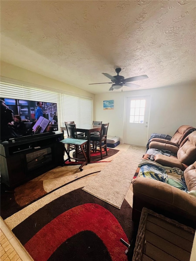 6316 Alaska Ave, New Port Richey, FL 34653 - living area featuring ceiling fan, a textured ceiling, and carpet flooring