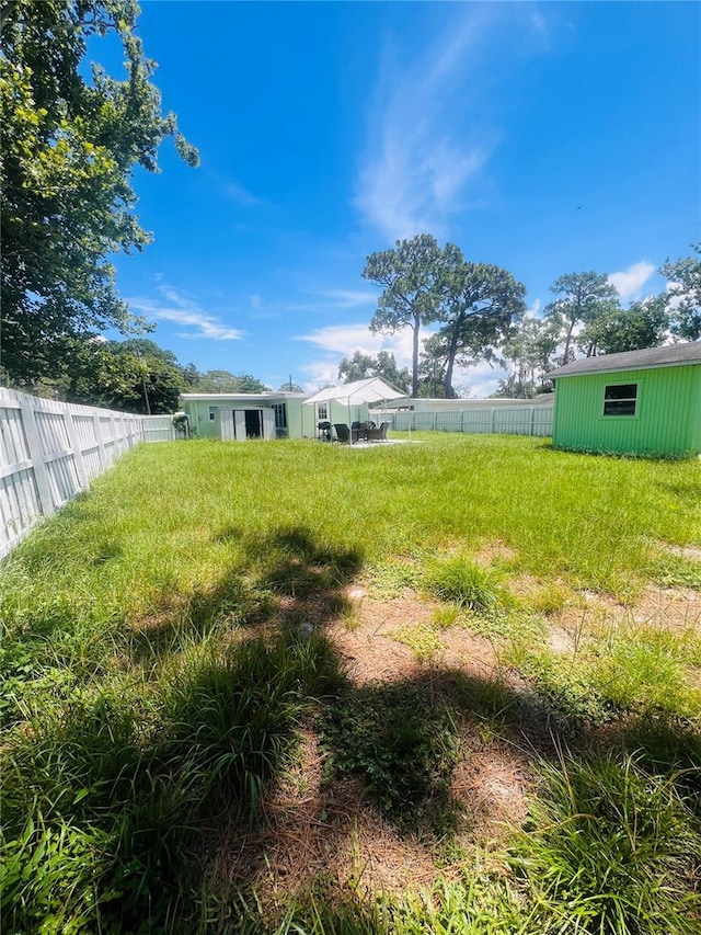 6316 Alaska Ave, New Port Richey, FL 34653 - view of yard with an outdoor structure