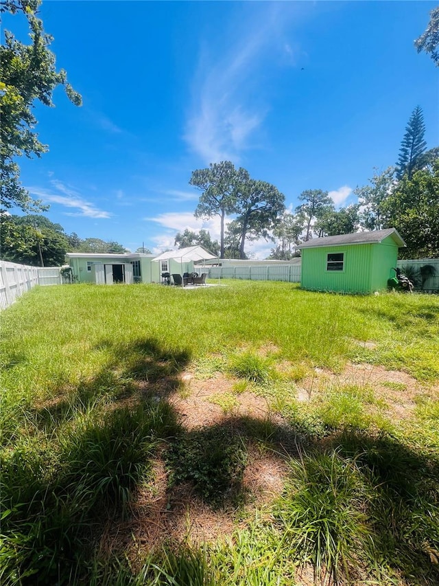6316 Alaska Ave, New Port Richey, FL 34653 - view of yard with a storage unit