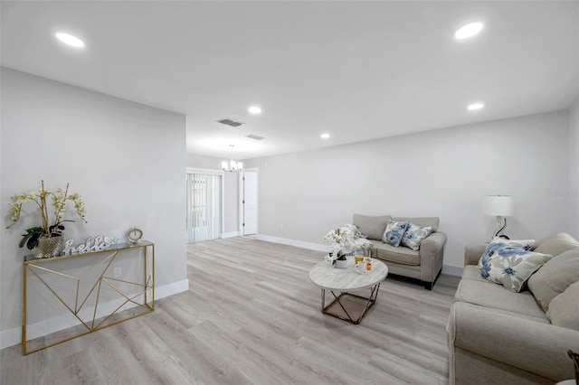 2585 Ridge Ln, Palm Harbor, FL 34684 - living area with a chandelier, wood finished floors, and recessed lighting