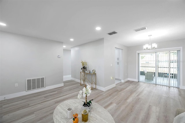 2585 Ridge Ln, Palm Harbor, FL 34684 - living room featuring a chandelier, light wood-style flooring, and recessed lighting