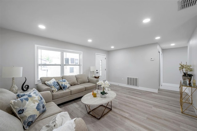 2585 Ridge Ln, Palm Harbor, FL 34684 - living area with light wood finished floors and recessed lighting