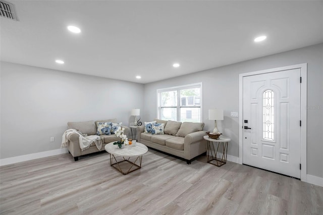 2585 Ridge Ln, Palm Harbor, FL 34684 - living room with light wood-style flooring and recessed lighting