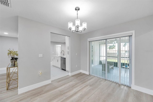 2585 Ridge Ln, Palm Harbor, FL 34684 - unfurnished dining area with a chandelier and light wood finished floors