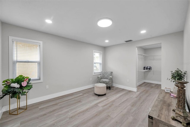 2585 Ridge Ln, Palm Harbor, FL 34684 - living area featuring light wood finished floors and recessed lighting
