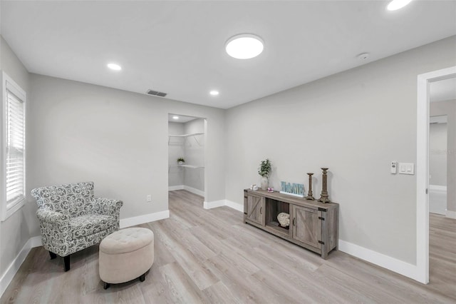 2585 Ridge Ln, Palm Harbor, FL 34684 - sitting room with wood finished floors and recessed lighting