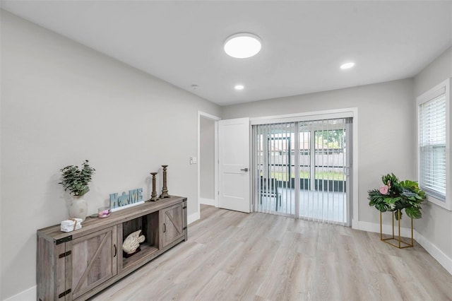 2585 Ridge Ln, Palm Harbor, FL 34684 - empty room with light wood-style floors, healthy amount of natural light, and recessed lighting