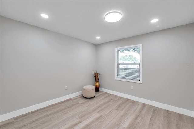 2585 Ridge Ln, Palm Harbor, FL 34684 - empty room featuring wood finished floors and recessed lighting