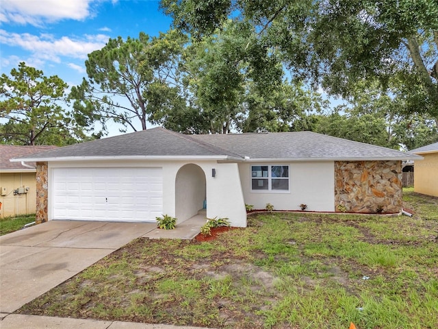 2585 Ridge Ln, Palm Harbor, FL 34684 - ranch-style house with an attached garage, stone siding, driveway, and stucco siding