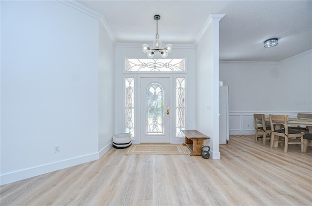 3012 Colonial Ridge Dr, Brandon, FL 33511 - entryway with ornamental molding, a chandelier, wood finished floors, and a wainscoted wall