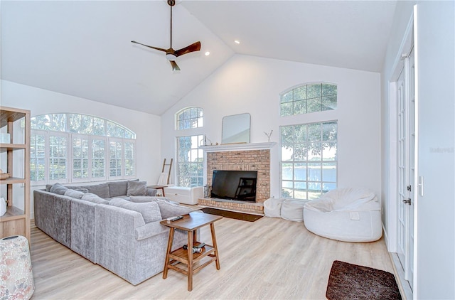 3012 Colonial Ridge Dr, Brandon, FL 33511 - living area featuring high vaulted ceiling, light wood-type flooring, ceiling fan, a brick fireplace, and recessed lighting