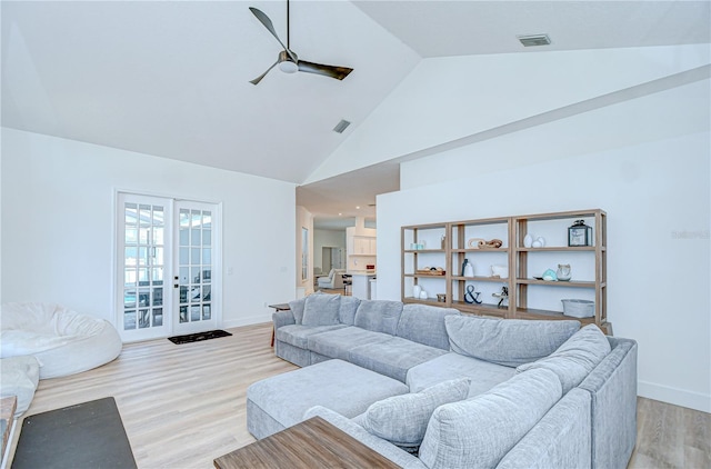 3012 Colonial Ridge Dr, Brandon, FL 33511 - living area with a ceiling fan, high vaulted ceiling, light wood-type flooring, and french doors