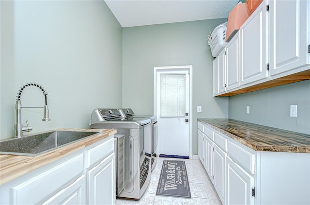 3012 Colonial Ridge Dr, Brandon, FL 33511 - laundry room featuring cabinet space, separate washer and dryer, and light tile patterned floors
