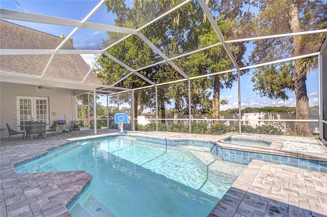 3012 Colonial Ridge Dr, Brandon, FL 33511 - view of swimming pool with a patio area, french doors, a pool with connected hot tub, and glass enclosure