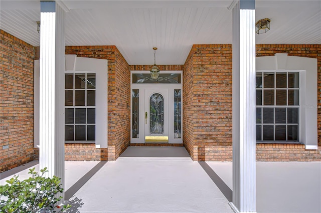 3012 Colonial Ridge Dr, Brandon, FL 33511 - view of exterior entry featuring brick siding and covered porch