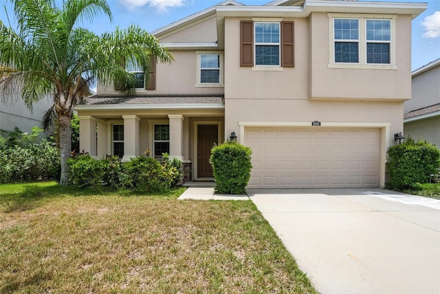 10603 Avian Forrest Dr, Riverview, FL 33578 - view of front facade with stucco siding, driveway, a front yard, and an attached garage