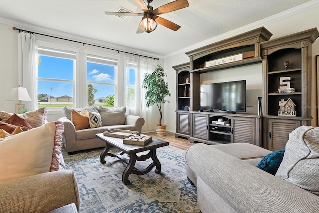 10603 Avian Forrest Dr, Riverview, FL 33578 - living area featuring ceiling fan, crown molding, and light wood-style flooring