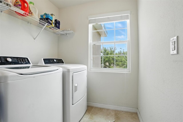 10603 Avian Forrest Dr, Riverview, FL 33578 - washroom with washing machine and clothes dryer and light tile patterned flooring