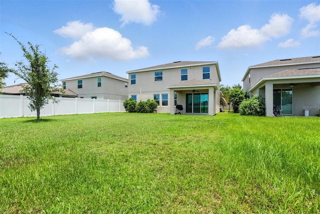 10603 Avian Forrest Dr, Riverview, FL 33578 - back of property with a ceiling fan, stucco siding, and a shingled roof