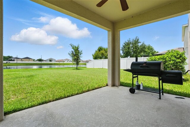 10603 Avian Forrest Dr, Riverview, FL 33578 - view of patio with ceiling fan, a water view, a residential view, and grilling area