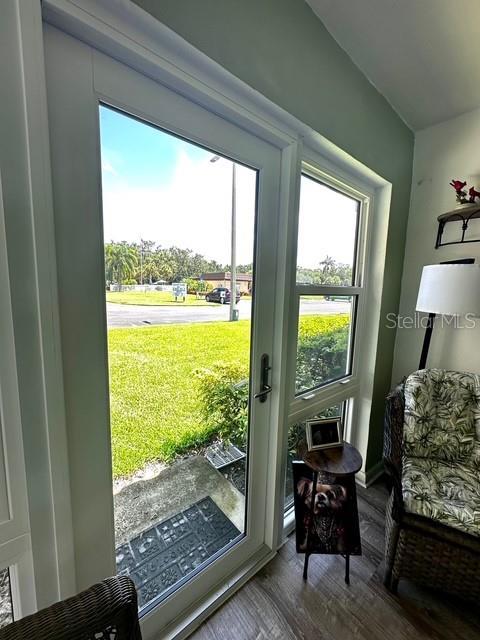 1701 Pinehurst Rd Unit 13C, Dunedin, FL 34698 - doorway featuring wood finished floors