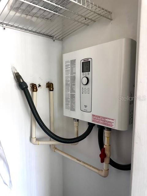 1701 Pinehurst Rd Unit 13C, Dunedin, FL 34698 - detailed view of tankless water heater