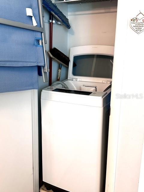 1701 Pinehurst Rd Unit 13C, Dunedin, FL 34698 - laundry room with washer / clothes dryer