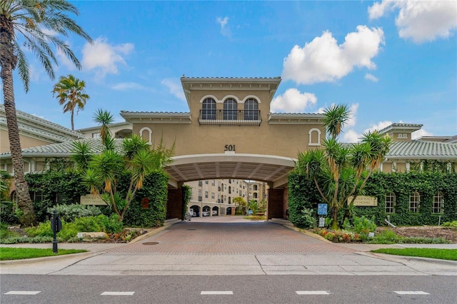 501 Knights Run Ave Unit 1317, Tampa, FL 33602 - view of building exterior featuring decorative driveway and a carport