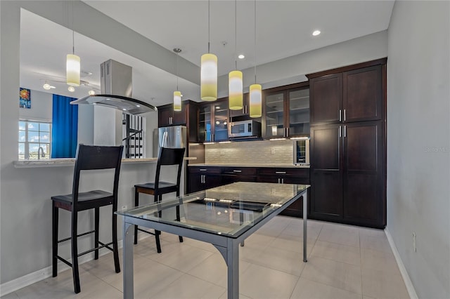 501 Knights Run Ave Unit 1317, Tampa, FL 33602 - kitchen featuring appliances with stainless steel finishes, dark brown cabinetry, tasteful backsplash, hanging light fixtures, and recessed lighting