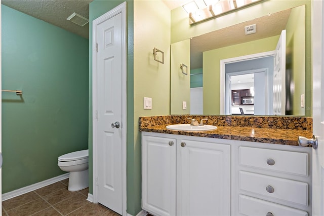 501 Knights Run Ave Unit 1317, Tampa, FL 33602 - bathroom with vanity, tile patterned floors, and a textured ceiling