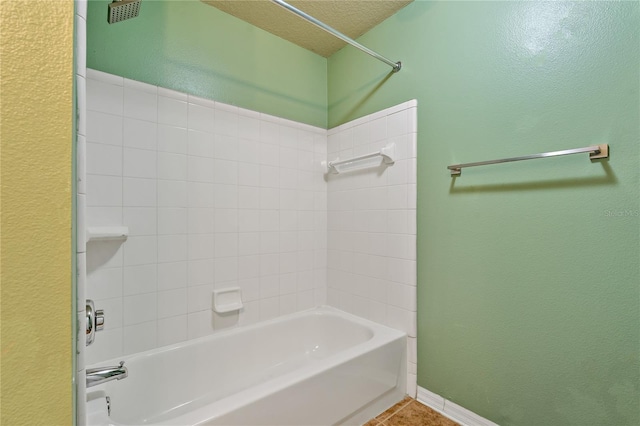 501 Knights Run Ave Unit 1317, Tampa, FL 33602 - full bathroom featuring shower / tub combination, a textured wall, and tile patterned floors