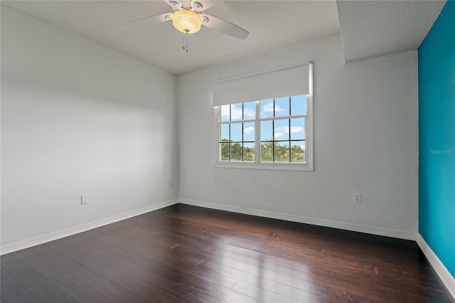 501 Knights Run Ave Unit 1317, Tampa, FL 33602 - spare room featuring dark wood finished floors and a ceiling fan