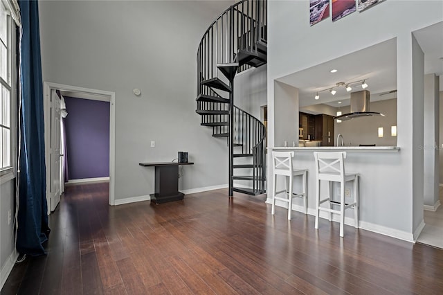 501 Knights Run Ave Unit 1317, Tampa, FL 33602 - living area with hardwood / wood-style floors, a high ceiling, and stairway
