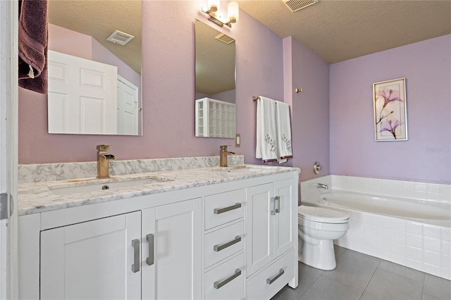 501 Knights Run Ave Unit 1317, Tampa, FL 33602 - full bathroom with double vanity, a garden tub, tile patterned flooring, and a textured ceiling