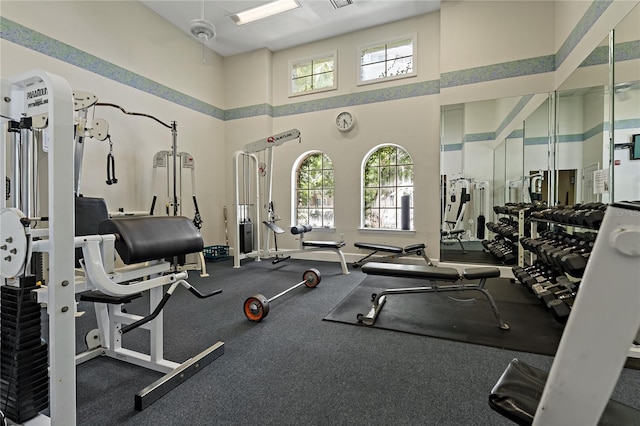 501 Knights Run Ave Unit 1317, Tampa, FL 33602 - exercise room featuring a towering ceiling and plenty of natural light