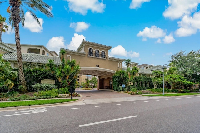 501 Knights Run Ave Unit 1317, Tampa, FL 33602 - mediterranean / spanish home with stucco siding, a tiled roof, and a carport