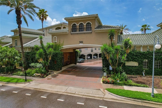 501 Knights Run Ave Unit 1317, Tampa, FL 33602 - view of front of house featuring decorative driveway, stucco siding, and a tile roof