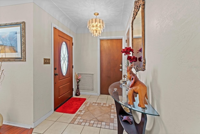 13565 86th Ave, Seminole, FL 33776 - entrance foyer with a chandelier and light tile patterned floors