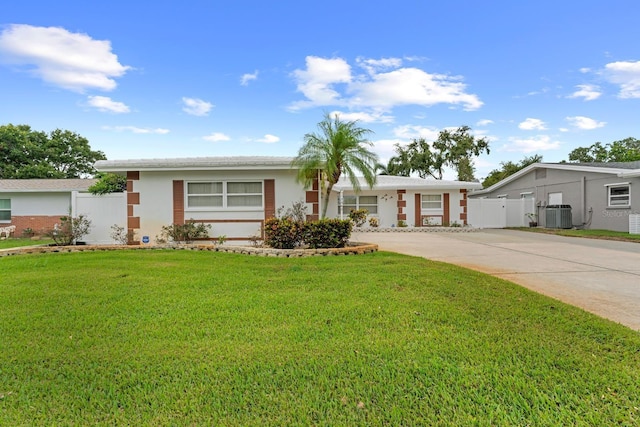 13565 86th Ave, Seminole, FL 33776 - ranch-style house with concrete driveway and stucco siding